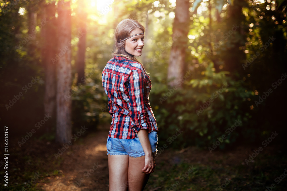 Beautiful woman smiling in forest