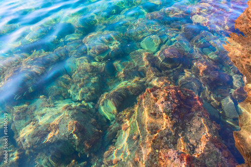 Stones under water, shallow depth, selective focus
