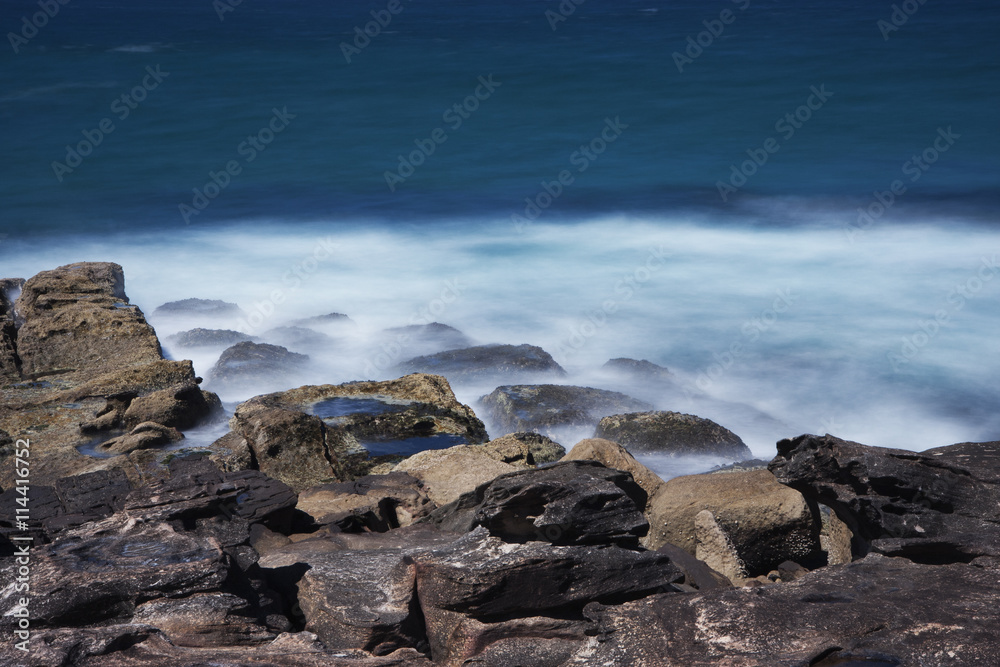 Waves breaking on the rocks of Manly Beach
