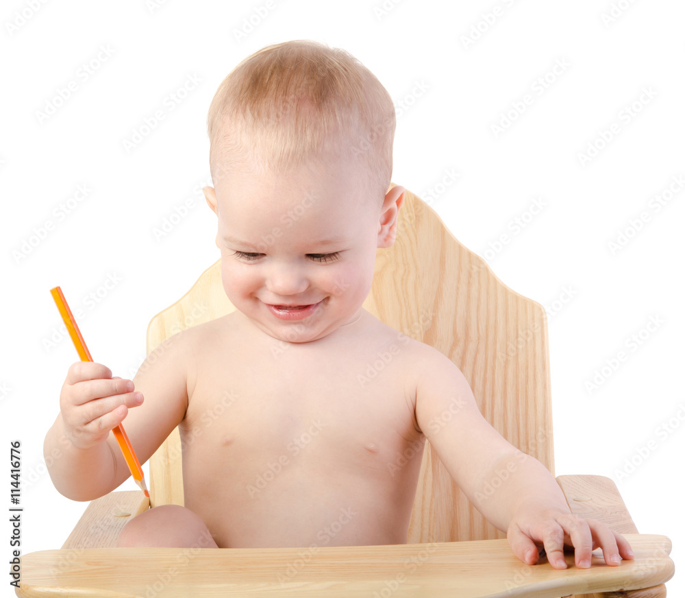 A boy draws with a pencil , isolated on white background A boy draws with a pencil , isolated on white background