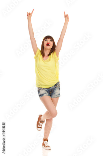 Girl Standing On One Leg And Pointing Up
