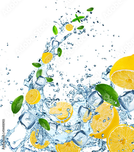 Fresh lemons in water splash.