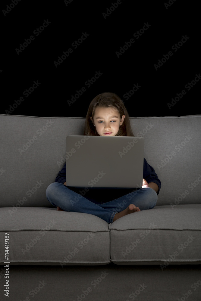 Little girl working with a laptop Little girl working with a laptop
