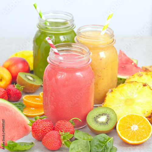 Fruits, berries and jars of fresh smoothie