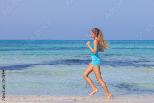 woman exercising on beach seashore
