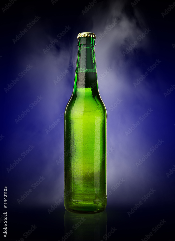 Cold wet beer bottle with frost and vapor