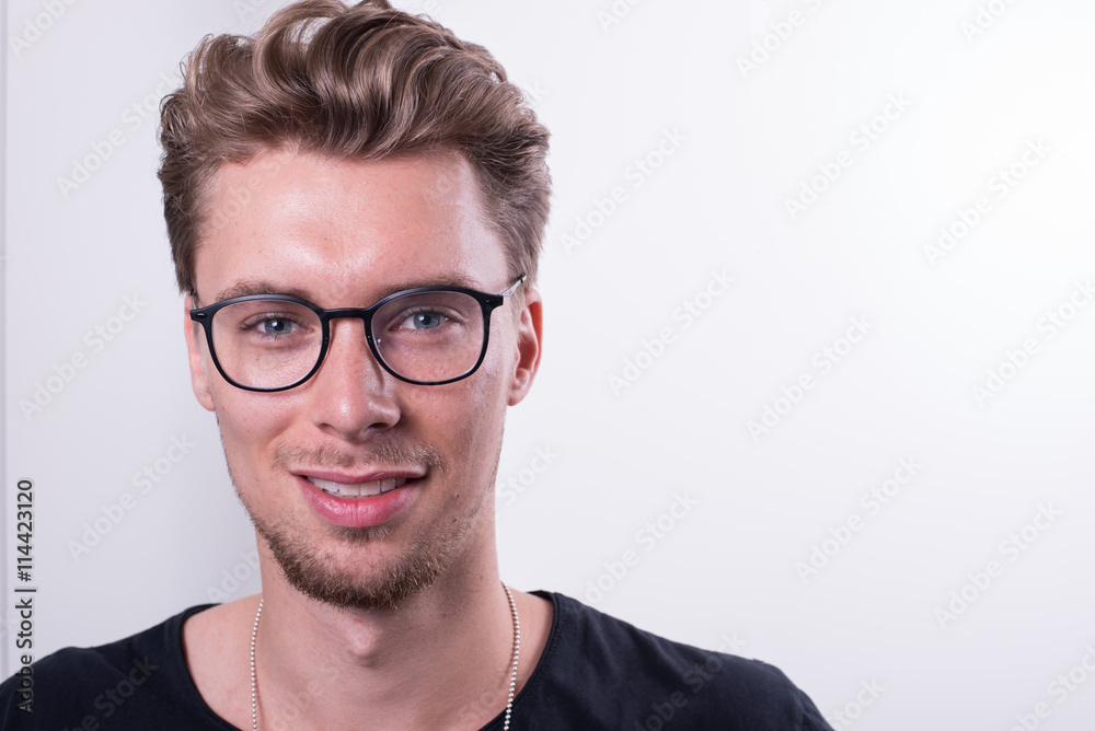 smart young professional smiling into the camera smart young professional smiling into the camera