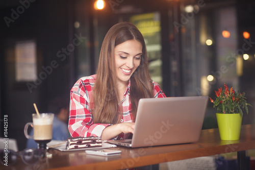 Freelance lady working in cafe