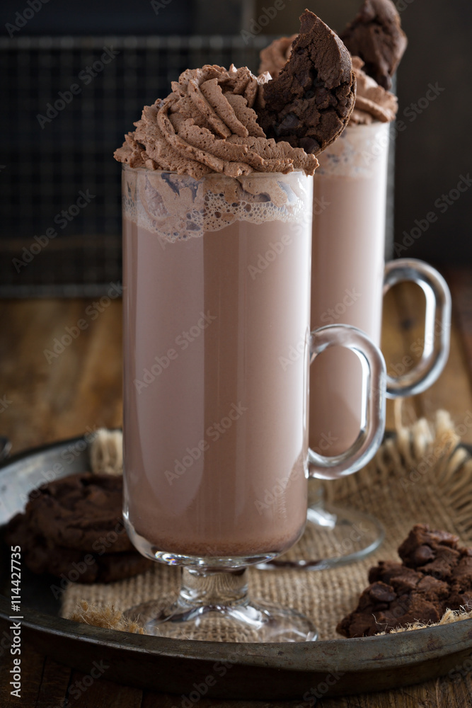 Chocolate cookie milkshake in tall mugs Chocolate cookie milkshake in tall mugs