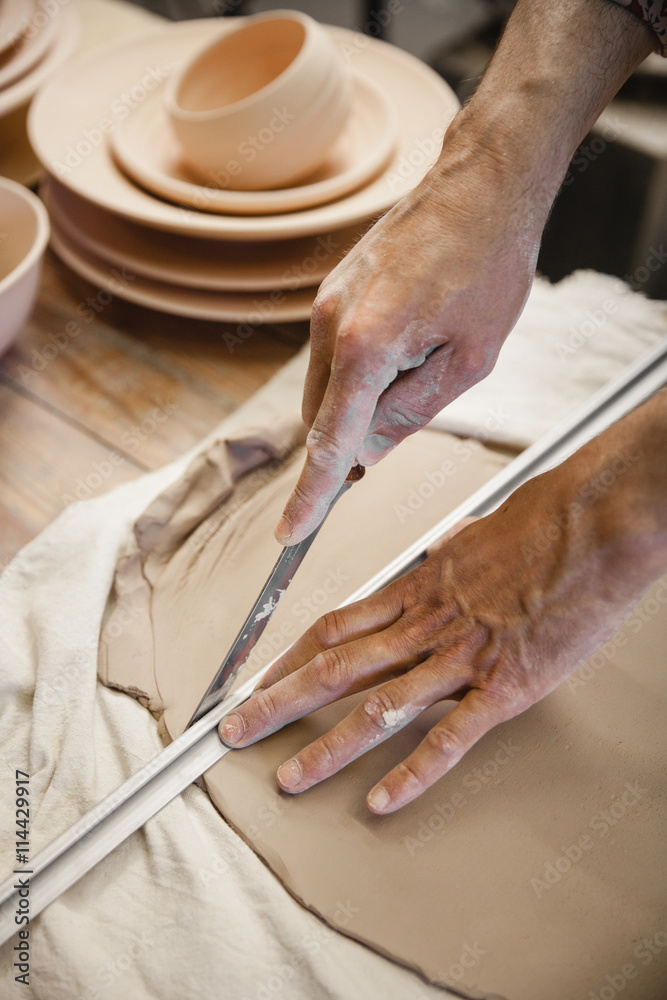Potter master cutting the clay Potter master cutting the clay