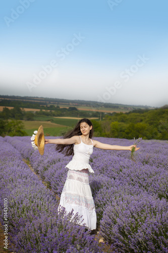 Beauty girl in the field of lavender