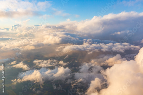 Fototapeta Naklejka Na Ścianę i Meble -  Cloudscape aerial view from airplane window seat
