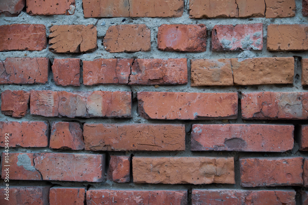 Red brick wall with cracked textured Red brick wall with cracked textured