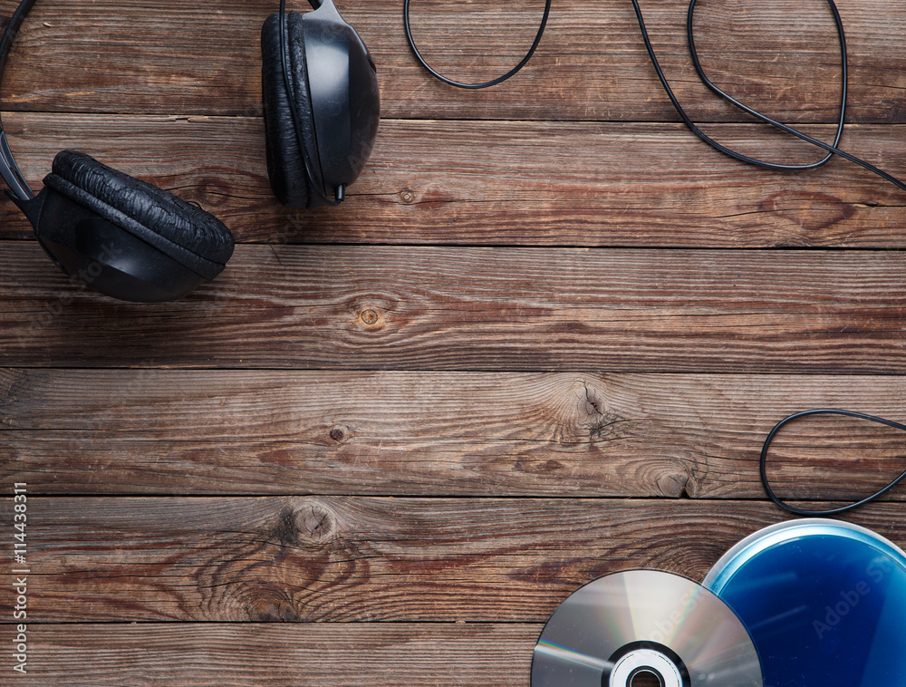 top view of music cd player equipment on wooden desk top view of music cd player equipment on wooden desk