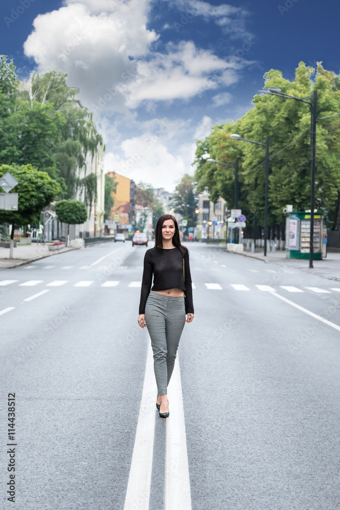 Woman walking on the road