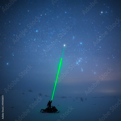 Night sky with laser beam, Lapland photo
