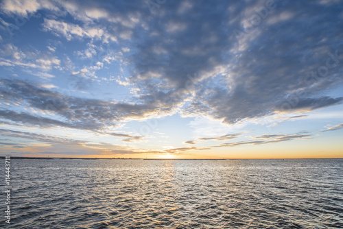 Sunset with beautiful clouds in the sea