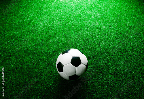 Soccer ball against artificial turf. Studio shot. Copy space.