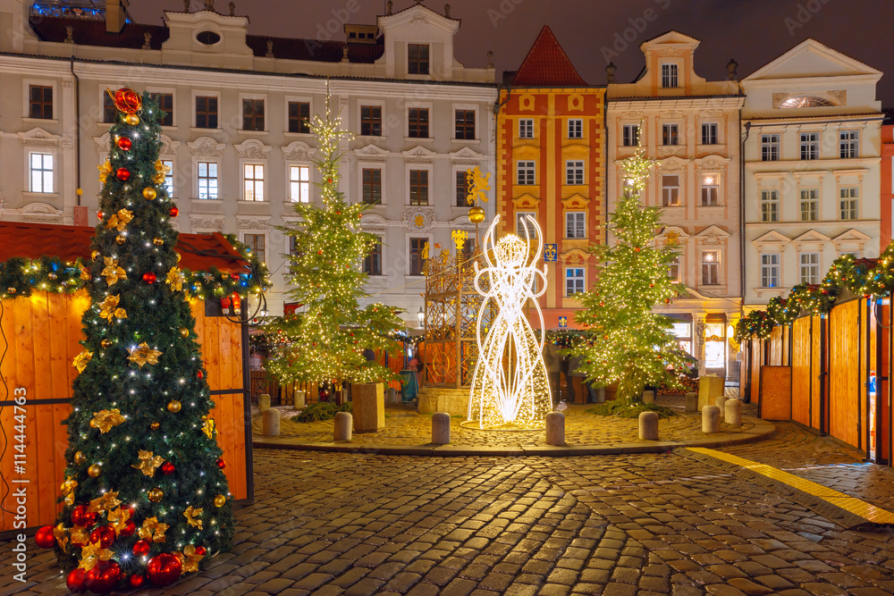 Fototapeta premium Christmas tree and holiday decorations in the Old Town in the magical city of Prague at night, Czech Republic