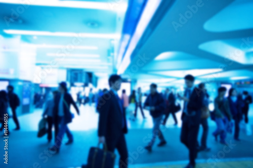 Blurred image of people with blue color filler