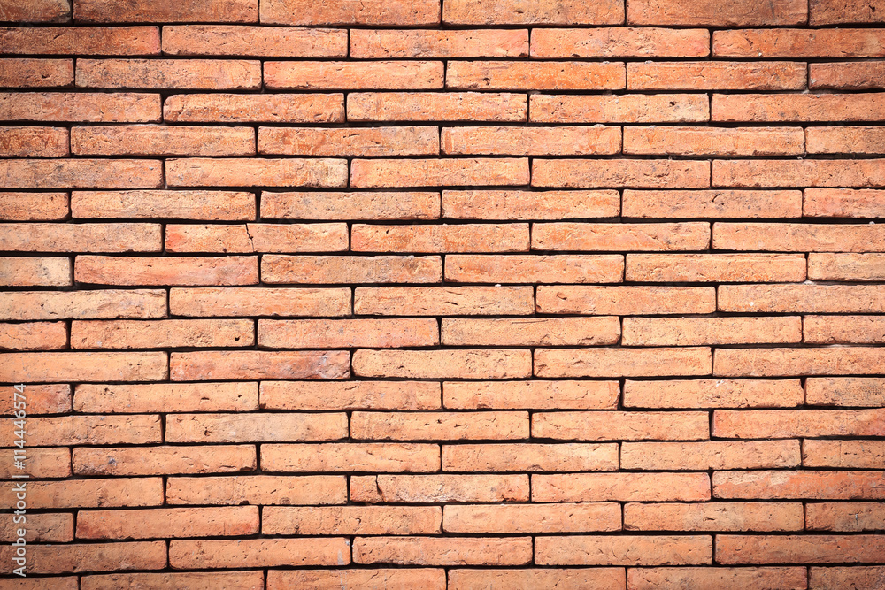 Closeup orange brick wall texture for background. Grunge retro vintage of brick wall. Part of old brick wall for design with copy space for text or image. Dark edged. Closeup orange brick wall texture for background. Grunge retro vintage of brick wall. Part of old brick wall for design with copy space for text or image. Dark edged.