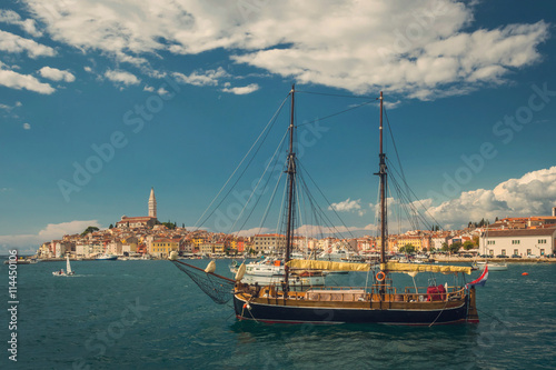 Old sailboat in the bay of old town Rovinj in Croatia, view from