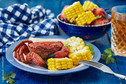 Boiled crab with corn on the cob and lemon.