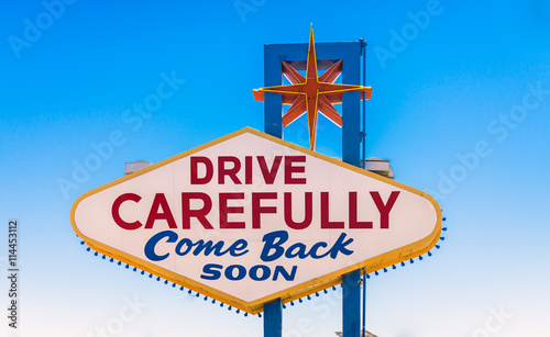 drive carefully, come back soon sign exiting Las Vegas, Nevada, USA