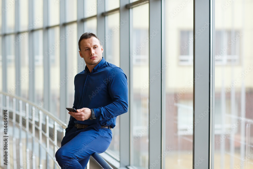 Young businessman with mobilephone. Young businessman with mobilephone.