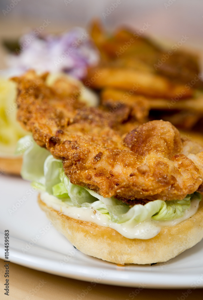Organic free range golden fried chicken breast fillet, served on a bed of lettuce, mayo and a white bread bun. Organic free range golden fried chicken breast fillet, served on a bed of lettuce, mayo and a white bread bun.