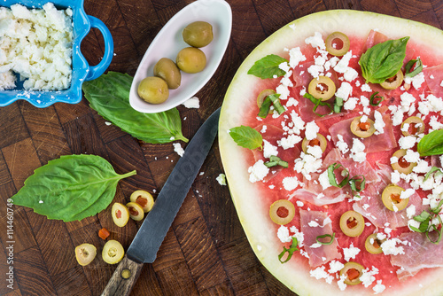 Φωτογραφία Watermelon pizza with crumbled feta cheese and prosciutto.