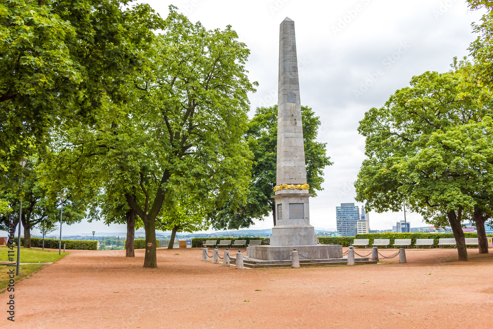 Obraz premium City park with benches. Obelisk in Denisovi sady.