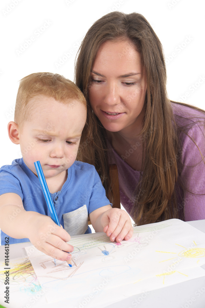 Mother and son are drawing the picture together Mother and son are drawing the picture together