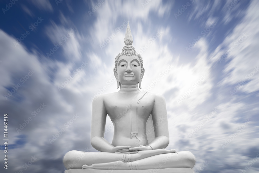 white image of Buddha with blue sky and cloud in background, light effect added,filtered image,radial blurred sky,moving cloud , prachuapkhirikhan,thailand