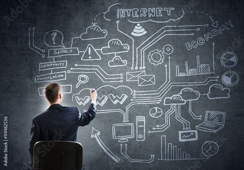 Businessman drawing business strategy