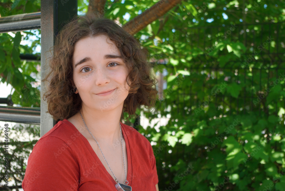 young woman portrait outside under a tree young woman portrait outside under a tree