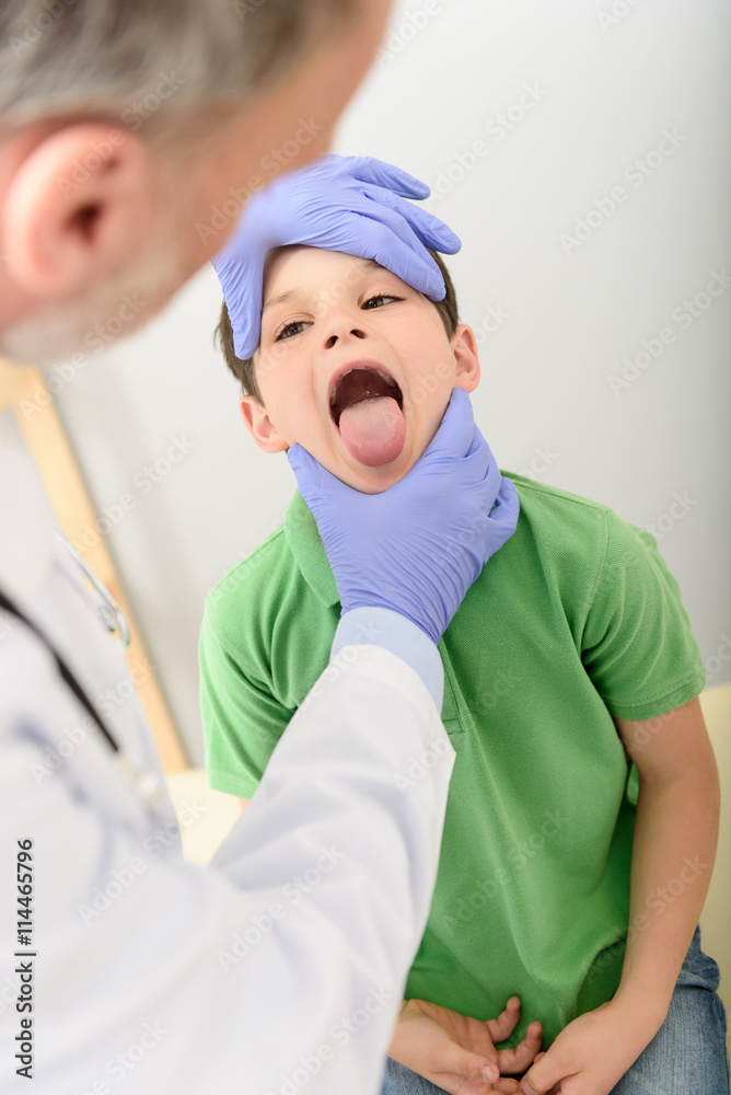 Pediatrician doctor examining small boy Pediatrician doctor examining small boy