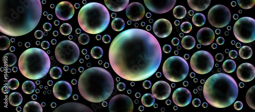 Plakat Rainbow bubbles on black - Randomly placed different sized rainbow colored bubbles on a wide black background