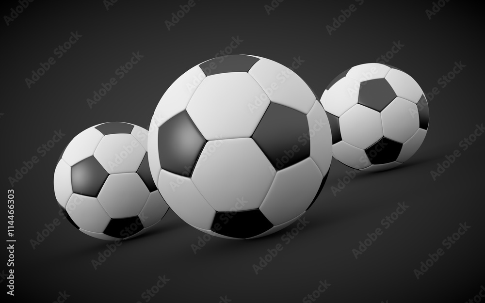 3D rendered soccer balls on black background. 3D rendered soccer balls on black background.