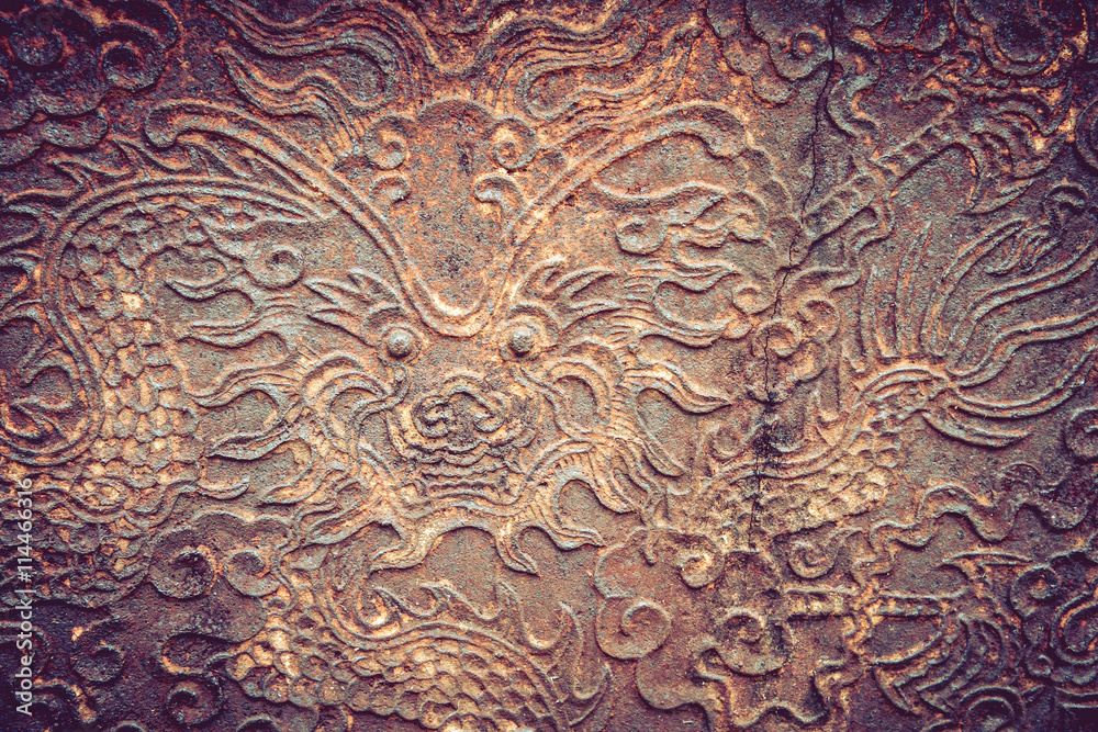 Old metal plate with dragon head