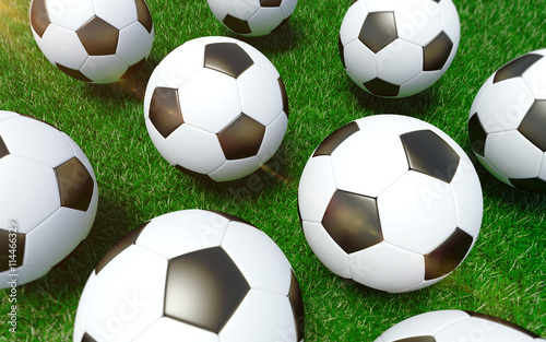 3D rendered soccer balls on the grass. Football background. © j0hntv