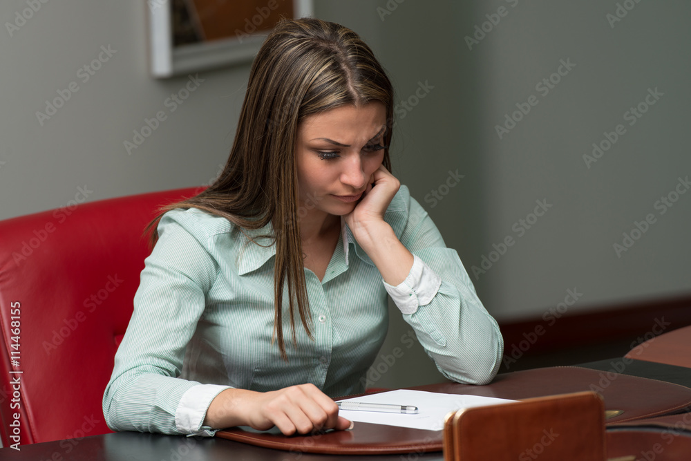 Young Businesswoman Having Stress In The Office Young Businesswoman Having Stress In The Office