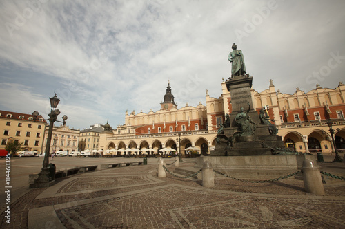 Market Square, the monument of Adam Mickiewicz, and Cloth Hall. Krakow, Poland