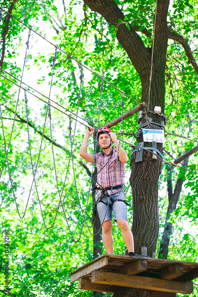 adventure climbing high wire park - people on course in mountain