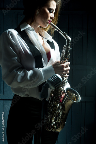 Photography retro woman with saxophone