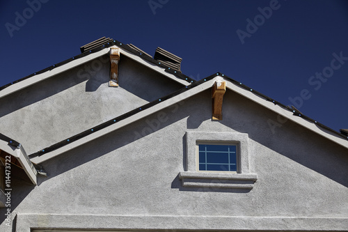 New home construction double gable roof and stucco