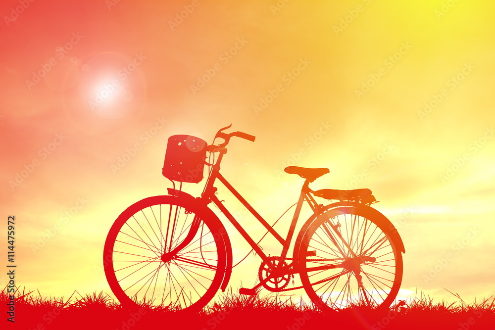 Fototapeta premium Silhouette bicycle at sunset