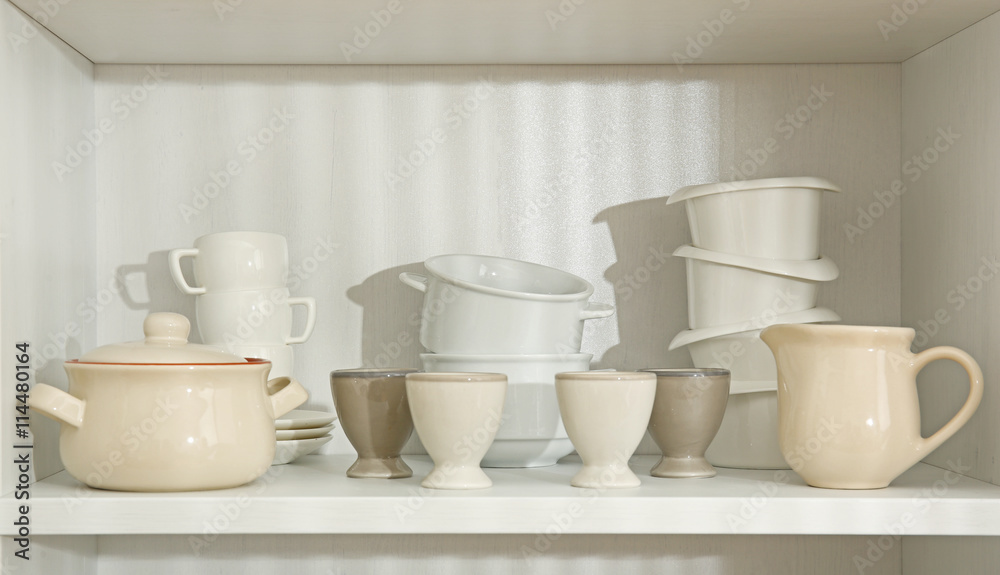 Dishes in cupboard in the kitchen Dishes in cupboard in the kitchen