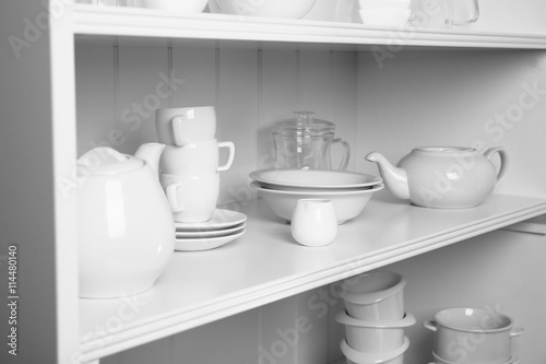 Dishes in cupboard in the kitchen