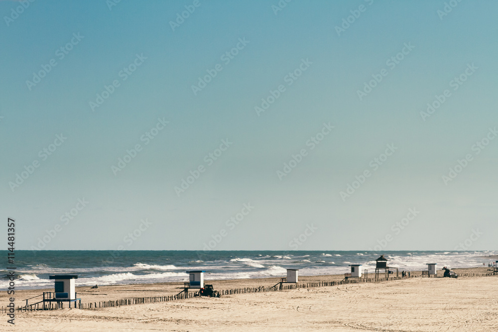 Several huts on empty beach at Argentina